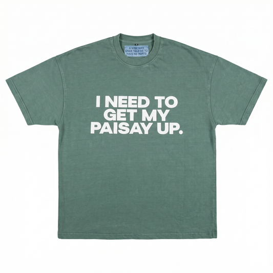 Green t-shirt with white text 'I NEED TO GET MY PAISAY UP.' on a white background